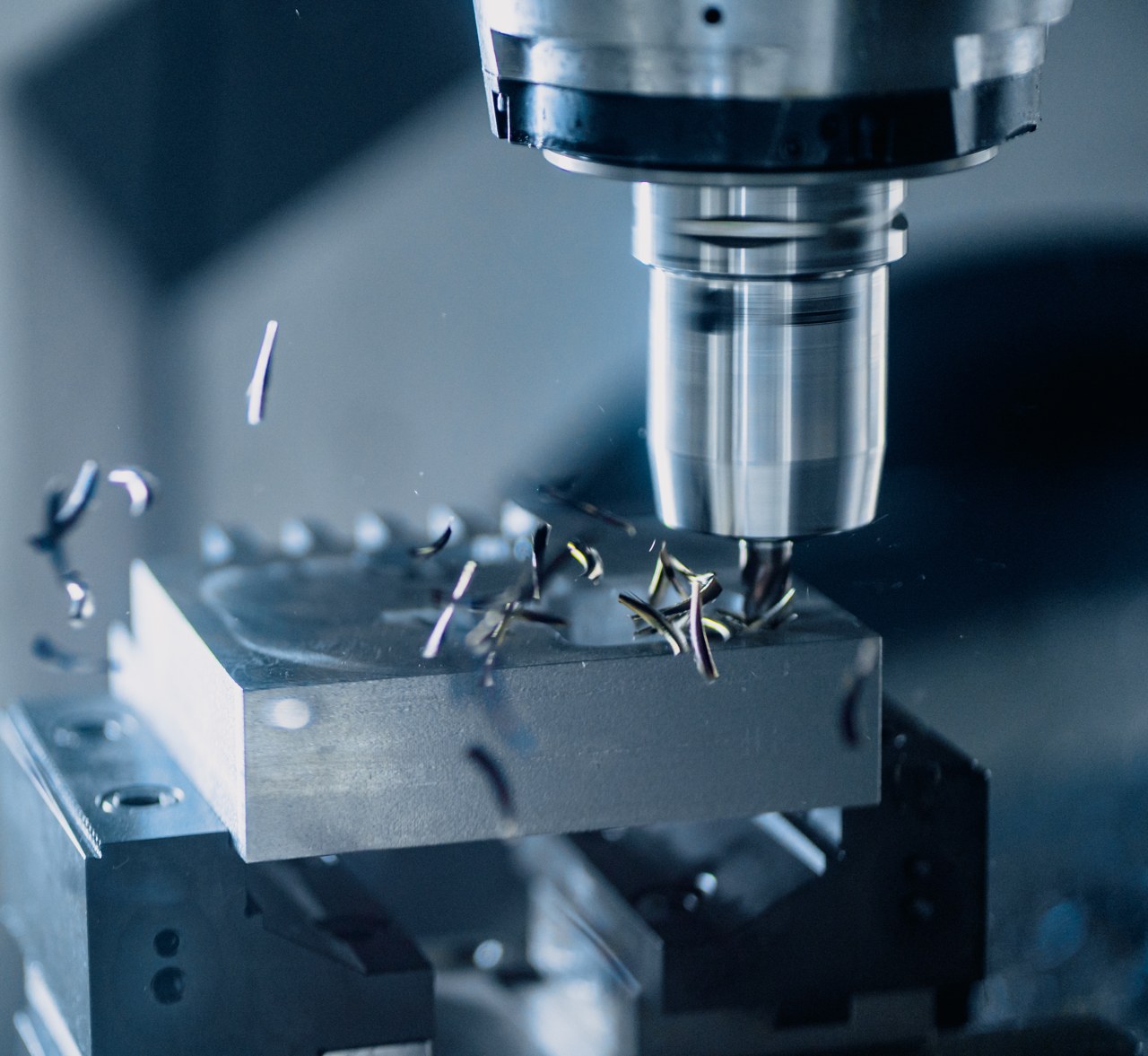CNC milling tool machining a precision metal component